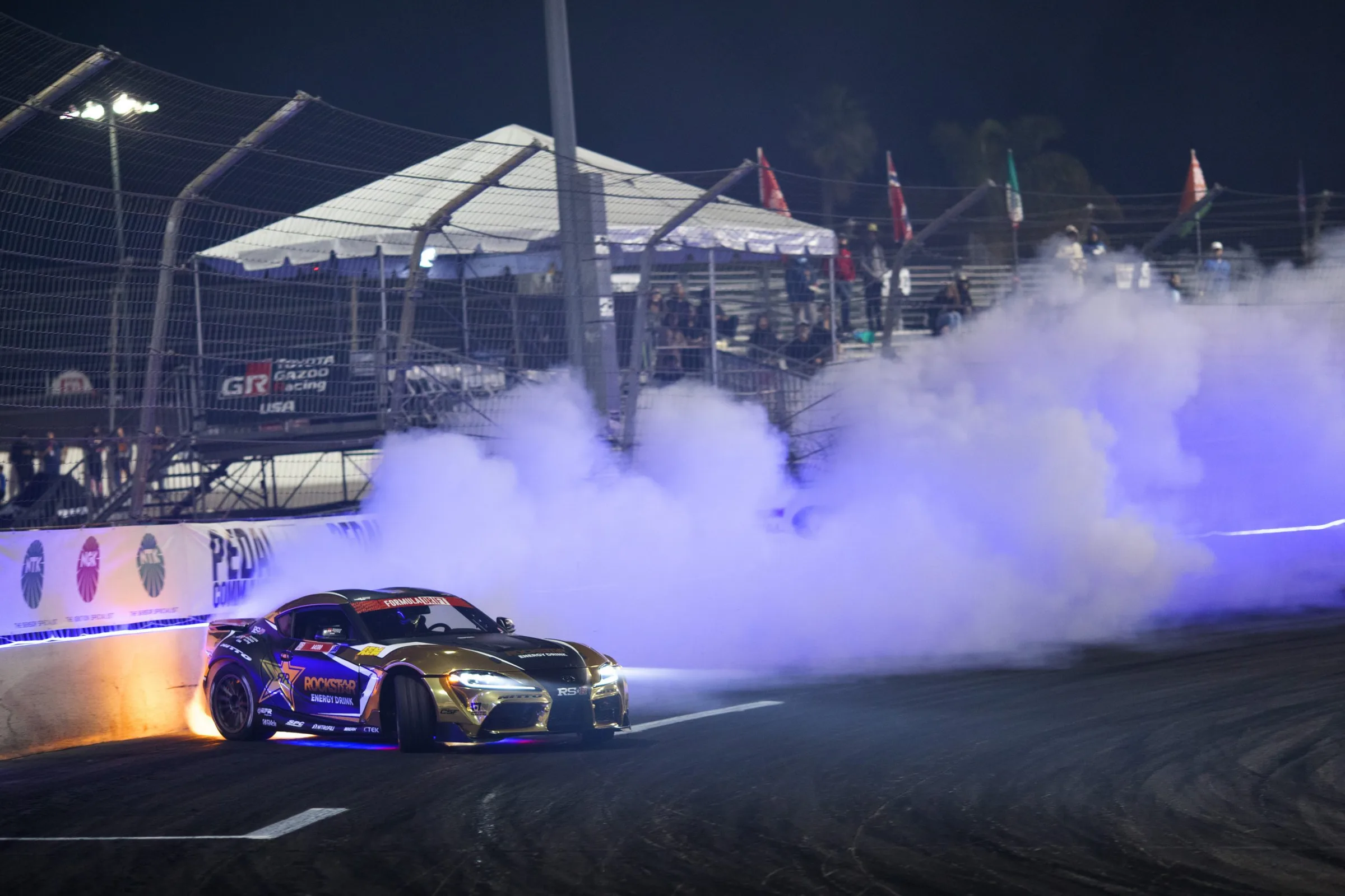 Formula Drift car generating smoke at Irwindale Speedway
