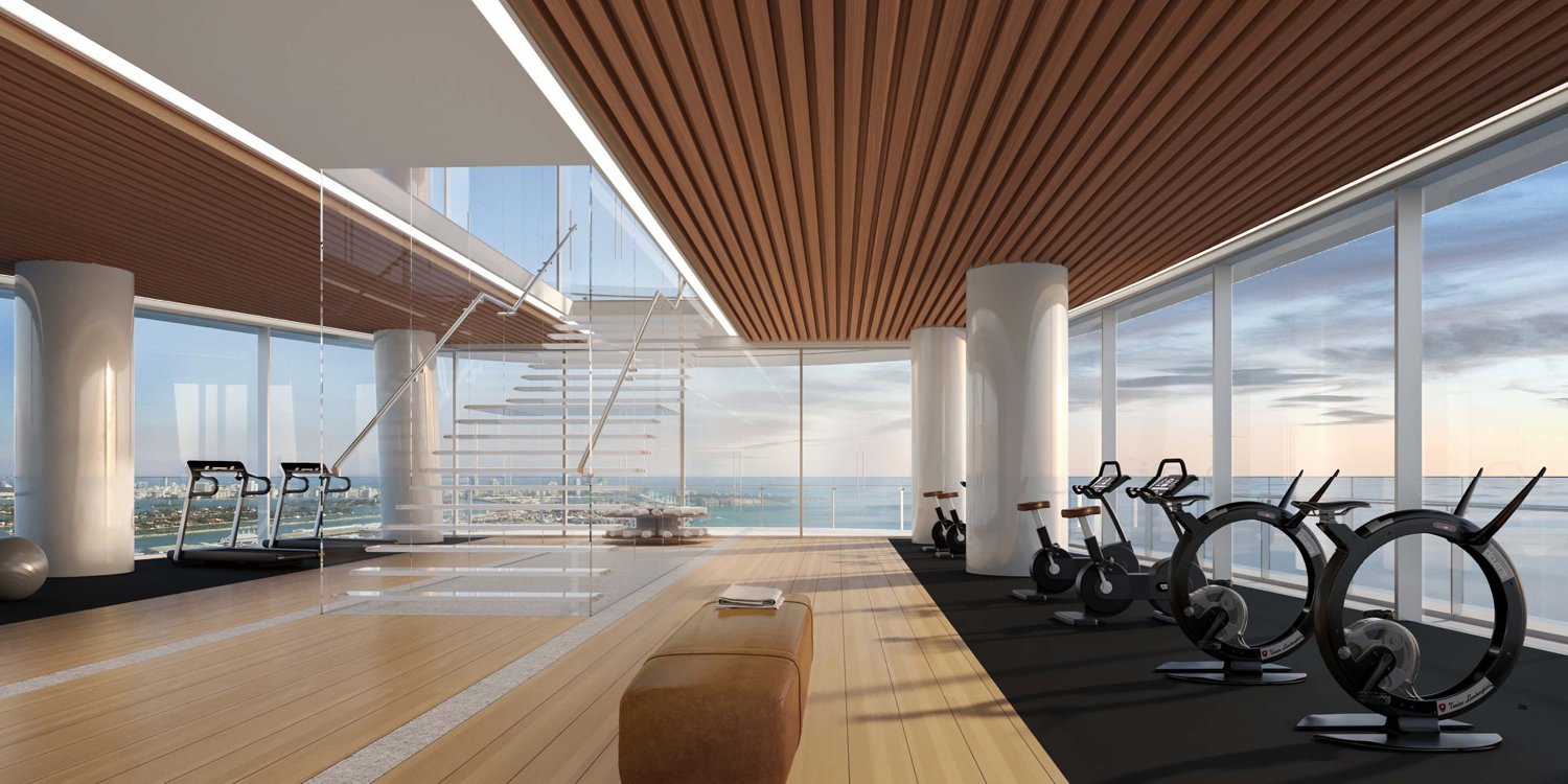 Aston Martin Residences: Gimnasio en las alturas, una escalera flotante sobre la bahía